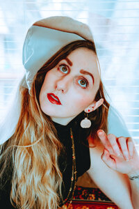 Artistic double-exposure portrait of Morgan Wright with soft blue and white tones.