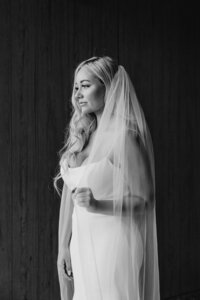 A classy bride in her elegant wedding dress and veil