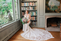 Los Angeles wedding photography bride portrait at a library venue with elegant fine art composition, true to life color, soft natural window light, and editorial bridal posing.