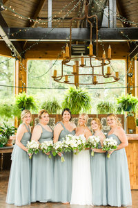 Bridesmaids in muted taupe dresses at a Gervasi Vineyard wedding photographed by akron ohio wedding photographer