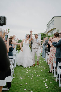 brie nad groom walk down the aisle after just getting married
