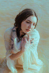 Soft creative portrait of an artist photographed outdoors.
