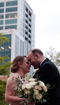 a newly wed couple in the middle of a city