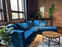 Elevation Boudoir's velvet blue couch used for posing in the studio