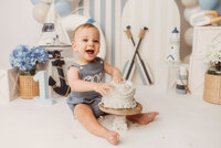 Baby celebrates his first birthday with a Cake Smash Portrait Session at Holy City Babies Portrait Studio in Charleston, SC.