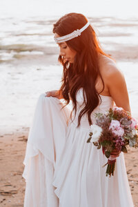 Bride during the photo shoot on the beach at Stanley Park in Vancouver