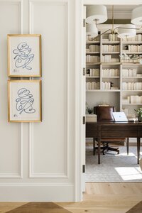 daley home sunny bell new construction gold picture frames on wall