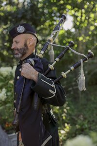 Bag piper stands ready to walk guests down the road.