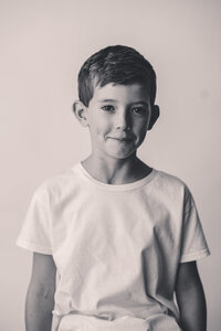 Little boy smiles at the camera during Personality Portrait Session in Charleston, SC.