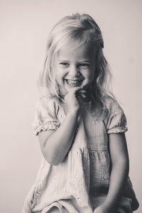 Little girl laughs at the camera during Personality Portrait Session in Charleston, SC.