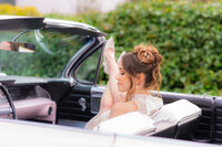 fashionable bride in classic car at hollins house in santa cruz
