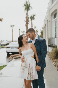 couple holding hands during engagement photos