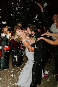 A couple's grand wedding exit with confetti