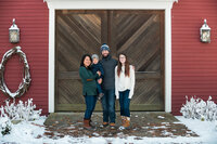 Winter family portrait at barn