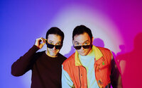 Indie musicians photographed together in a colorful creative portrait for their music project.