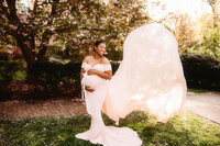 Maternity Photos in Charleston, SC -- Expectant mother poses for Maternity Portraits at Hampton Park in downtown Charleston, SC.