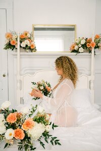 Styled bridal boudoir with peach floral design on vintage mantel by Flowergirl Cville at Virginia Creative Collective | Photo by Lyn Waldrop Photography