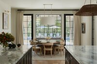 dalay home austin interior designer dining room table with large window overlooking pool