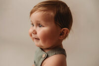 Profile Photo of an eight month old Baby during Baby Milestone Portrait Session at Holy City Babies Portrait Studio in Charleston, SC.