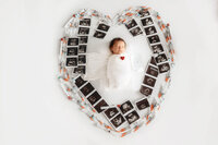 Infant posed for Newborn Baby Photos at Holy City Babies Portrait Studio in Charleston, SC.
