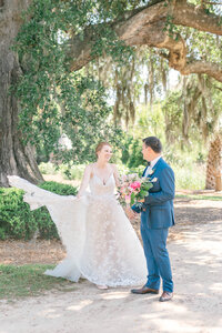 Charleston couple marries overlooking the Ashley River underneath an angel oak outside Charleston, SC