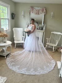 Bride posing inside The Love Loft bridal getting-ready space in Monroe, CT