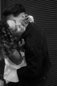 Emotional and unposed black and white couple moment - cinematic documentary style photography by Lucie Muse