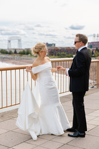 A bride and groom admire each other near the Canal Park lift bridge