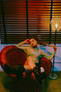 Colorful cyberpunk-inspired portrait with dramatic orange and teal lighting.