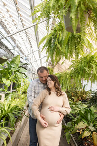 Man and woman posing for maternity photography in Metro Detroit