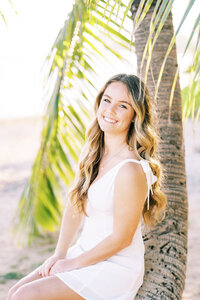 high school senior portrait sitting on a tree