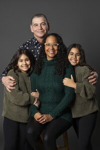 Studio family portrait in St. Albert with playful kids