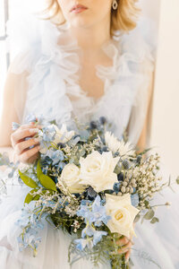 Close up of bride holding bridal bouquet during a spring wedding