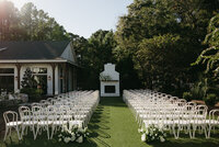 outdoor wedding ceremony with built in fireplace mantel