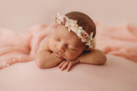 Infant posed for Newborn Baby Photos at Holy City Babies Portrait Studio in Charleston, SC.