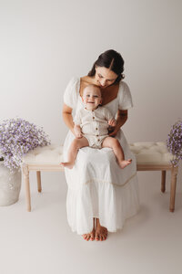 Charleston Motherhood Photographer - Mother poses with her baby during studio Mother's Day Mini Sessions at Holy City Babies Portrait Studio in Charleston, SC.