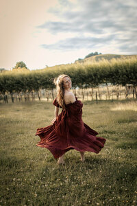 Mum posing and swishing dress on Family Photoshoot Hawkes Bay with Lightkeeper Photographer Family Maternity and Newborn Photographer Hawkes Bay