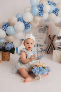 Baby celebrates her 1st birthday with a Cake Smash Photoshoot at Holy City Babies Portrait Studio in Charleston, SC.