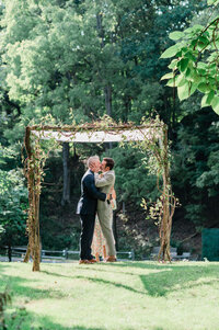 Husbands share their first kiss as newlyweds