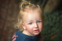 Young child outdoors at sunset with soft background blur in New Bern NC