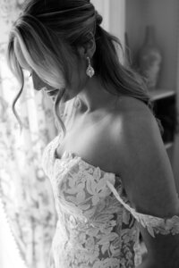 Bride looking down during an emotional moment captured in wedding photography Detroit MI
