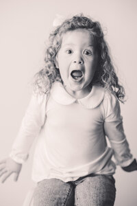 Little girl poses for Personality Portraits at Holy City Babies Portrait Studio in Charleston, South Carolina.