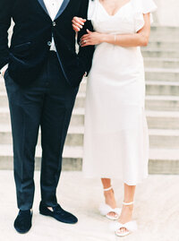 Man in blue suit and woman in wedding dress