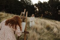 Painting session during a maternity photoshoot in Christchurch