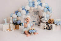 Baby celebrates her 1st birthday with a Cake Smash Photoshoot at Holy City Babies Portrait Studio in Charleston, SC.