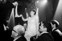 Two grooms dancing the Hora, a traditional Jewish wedding dance, during their wedding in San Sebastián