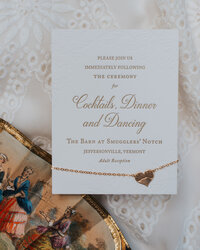 Cocktails Dinner and Dancing invitation for luxury wedding with gold embossed text on white paper