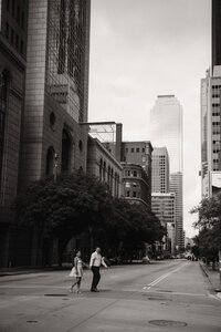 a newly engaged couple walks the streets of downtown dallas