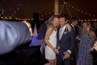 Guests enjoy dancing during tented wedding reception on Nantucket.