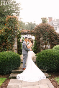 bride and groom portrait at golden hou0r at New England historic estate
